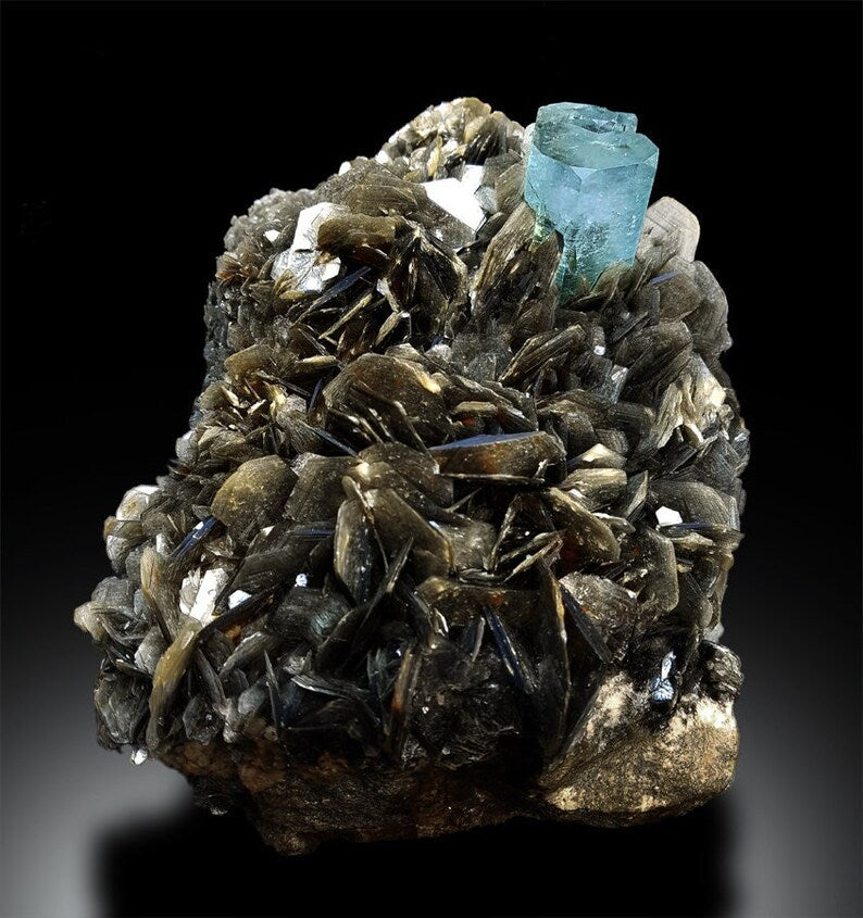 Natural aquamarine amazing color excellent luster
Large aquamarine specimen with silvery muscovite mica