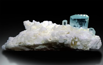 Natural aquamarine crystal showing gem grade blue transparency
White feldspar matrix with sky blue aquamarine crystal detail