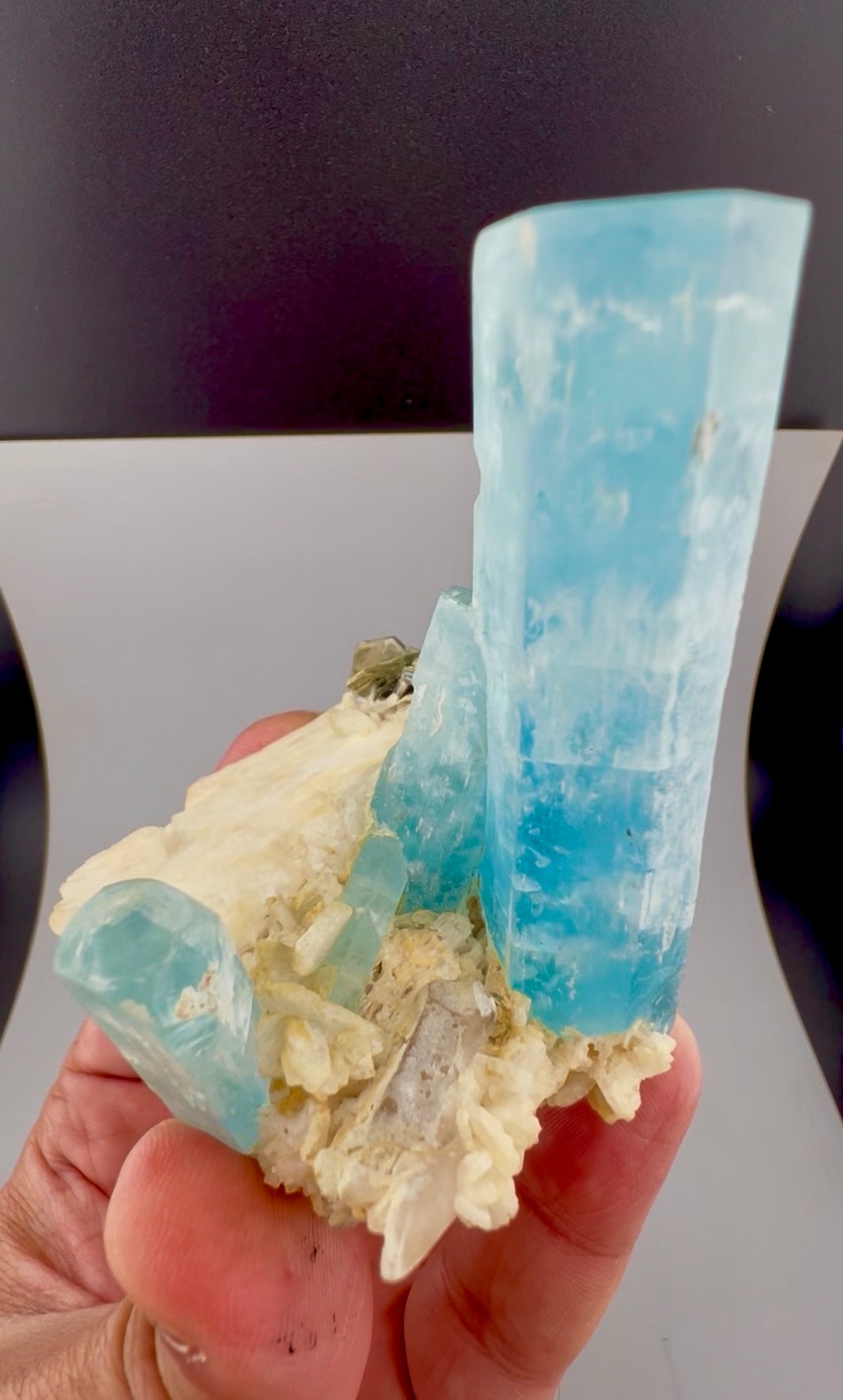Natural aquamarine crystals, terminated points visible
Aquamarine on feldspar specimen, bottom standing base