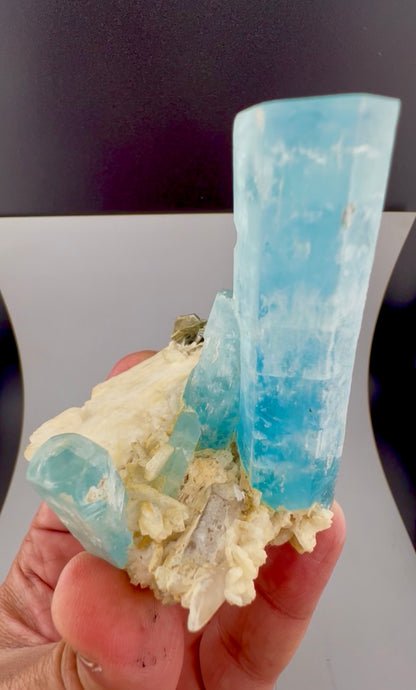 Natural aquamarine crystals, terminated points visible
Aquamarine on feldspar specimen, bottom standing base