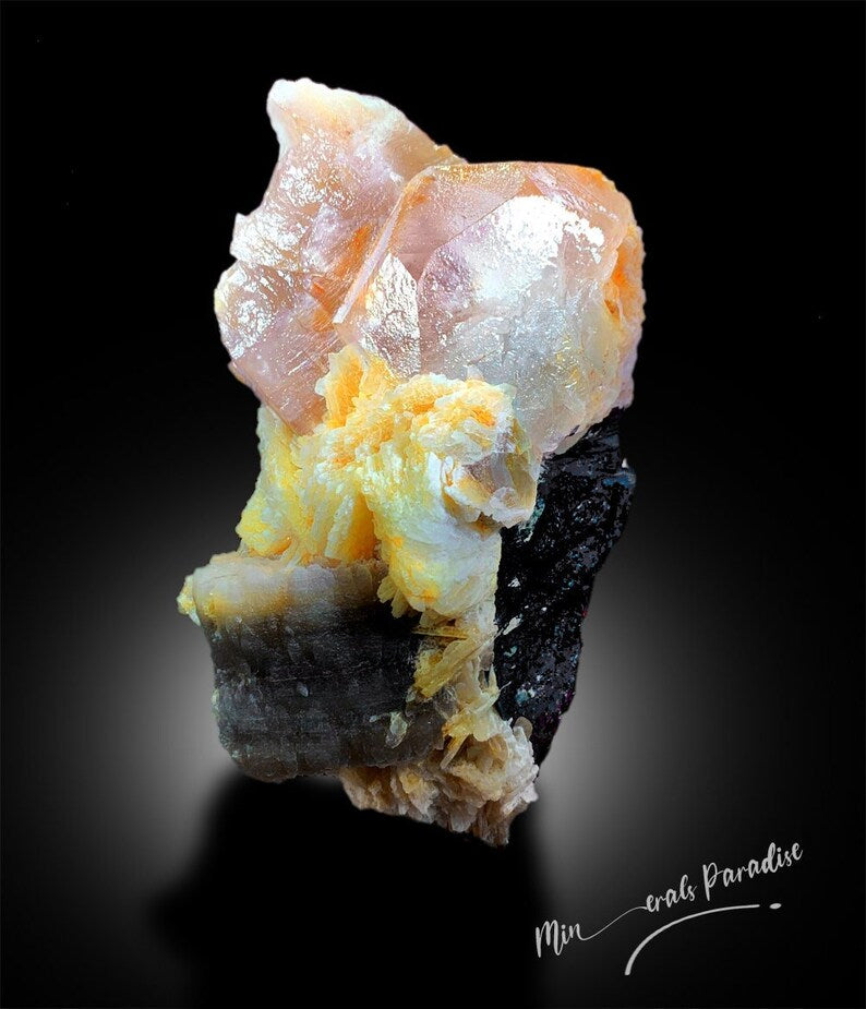 Natural bi-color beryl showing pink and blue color zones
AquaMorganite specimen with albite matrix Afghanistan
