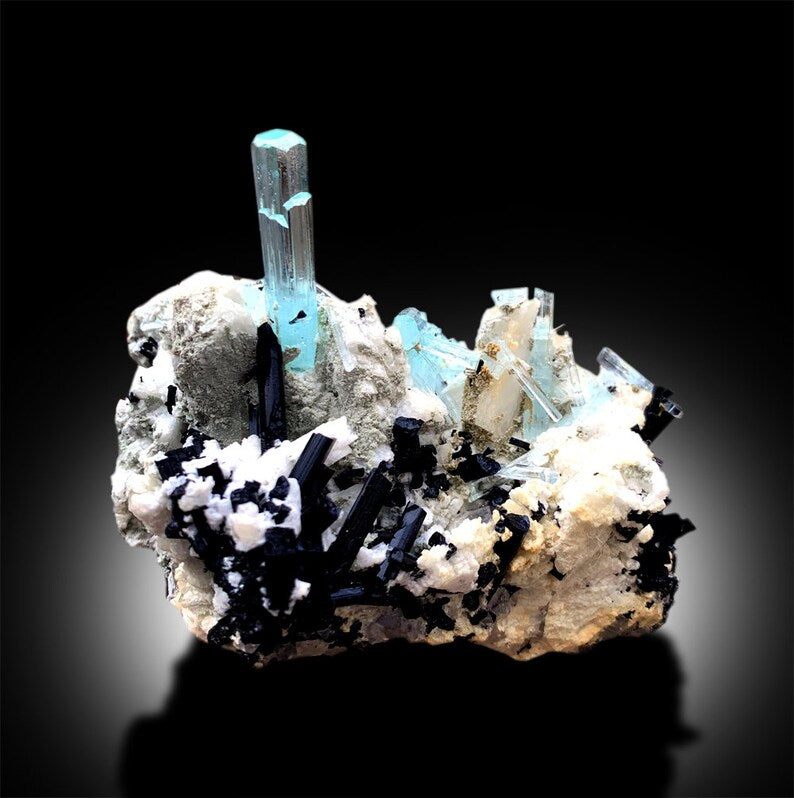 Natural blue aquamarine with black tourmaline contrast