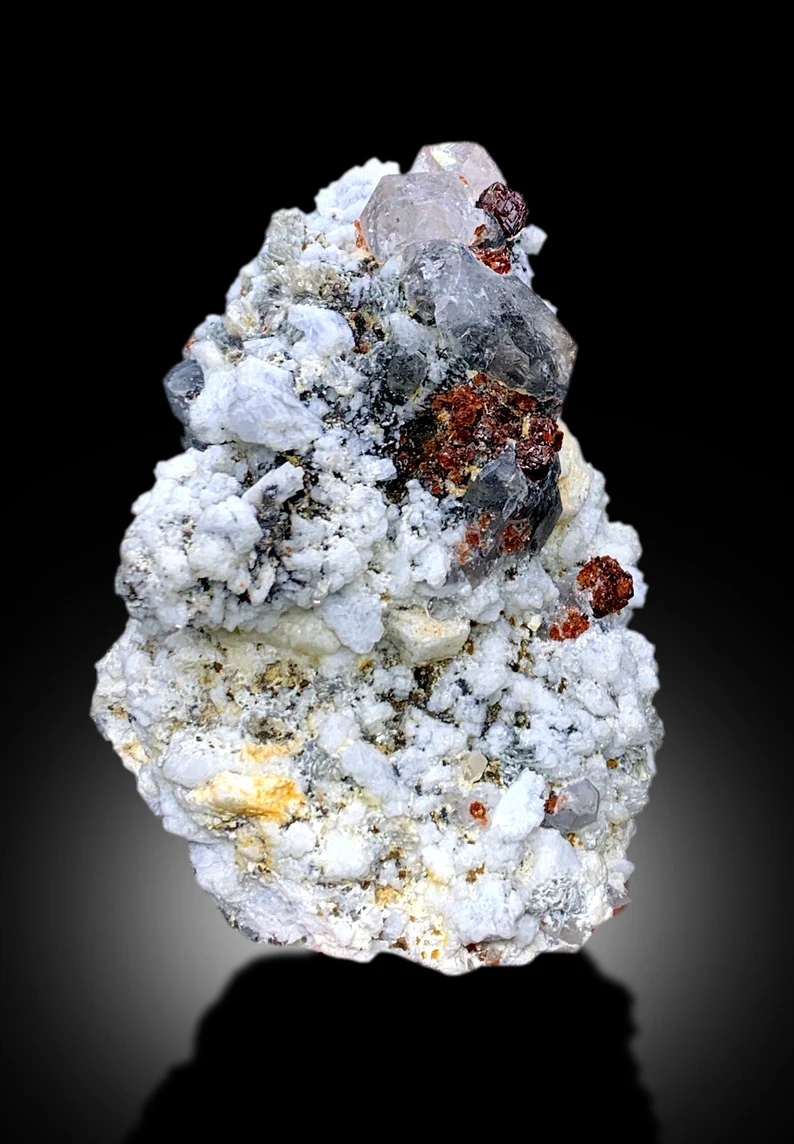 Self standing red garnet specimen, display angle
Natural garnet crystal cluster, side profile
Red garnet on quartz, top down view