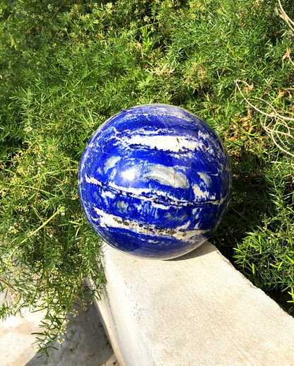 Deep blue lapis lazuli polished ball close-up
Natural lapis lazuli sphere home decor display piece