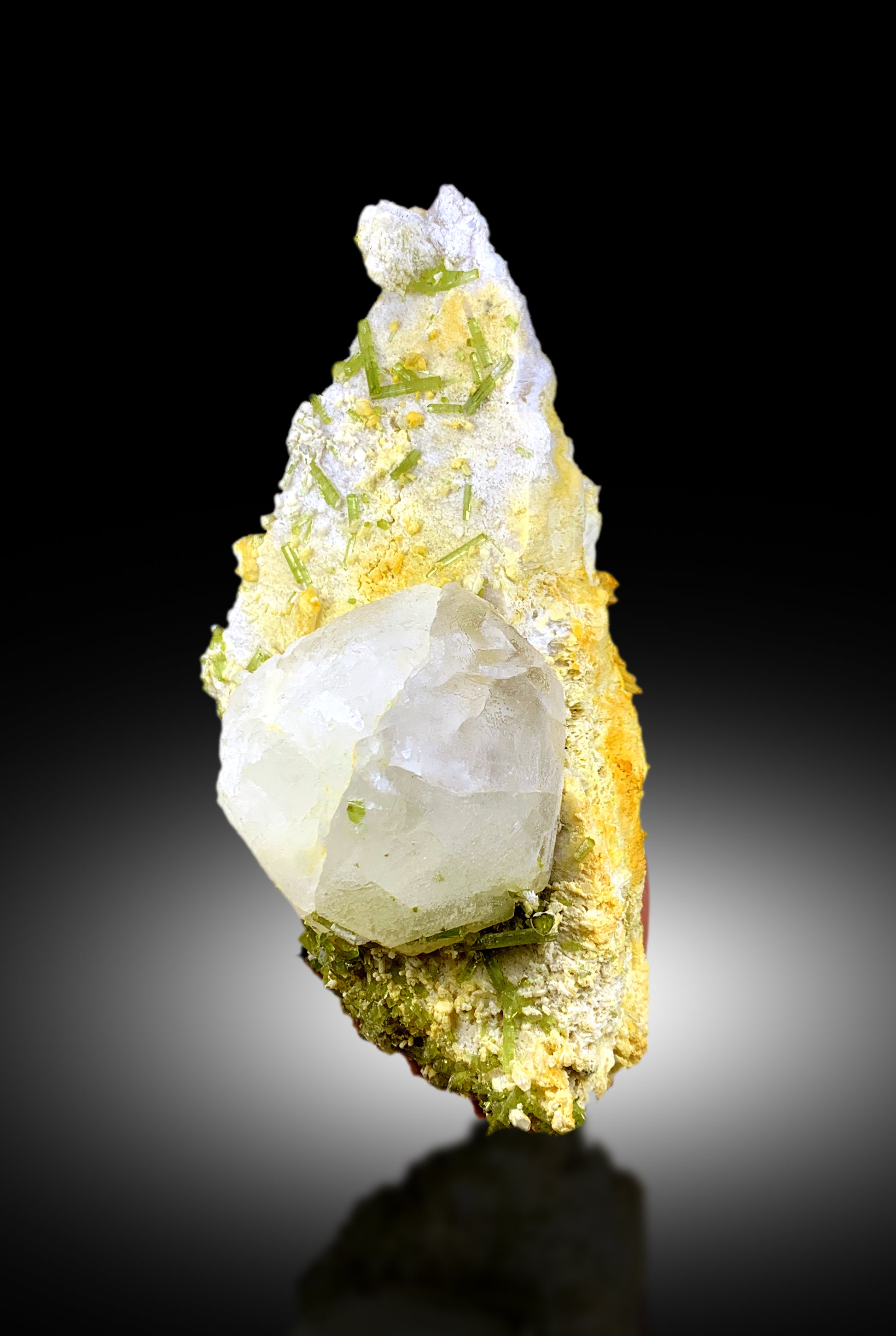 Natural mineral specimen with pollucite and feldspar
Tourmaline crystal cluster lighting and color detail