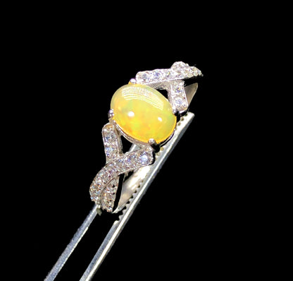 Ethiopian Welo opal ring play-of-color with zircon accents
Natural opal and zircon ring 25x21mm centerpiece