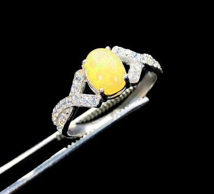 Natural opal zircon ring showing rainbow color shift
Handmade opal ring Ethiopia white band close-up