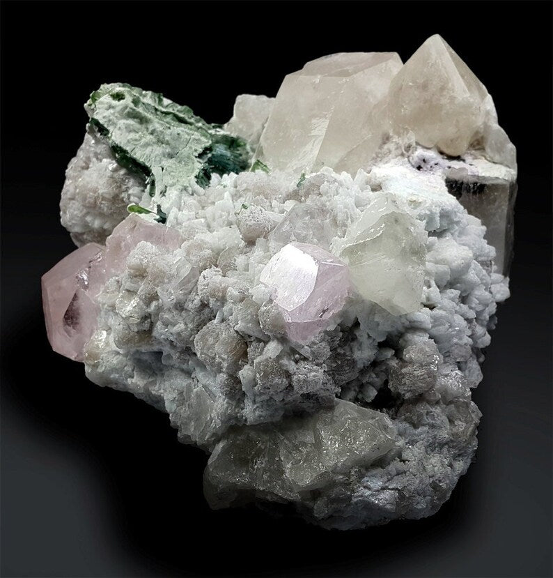 Natural pink morganite crystal cluster with blue tourmaline
Indicolite tourmaline crystals on morganite and lepidolite specimen