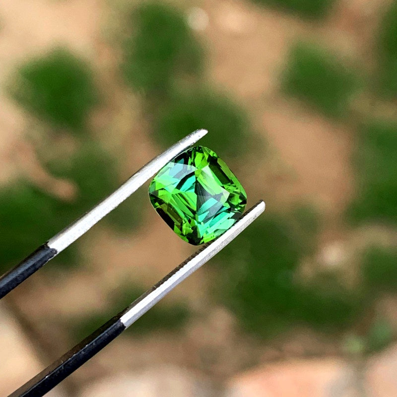 Natural tourmaline loose stone 9x7mm close-up
Bi-color tourmaline gemstone showing two-tone color