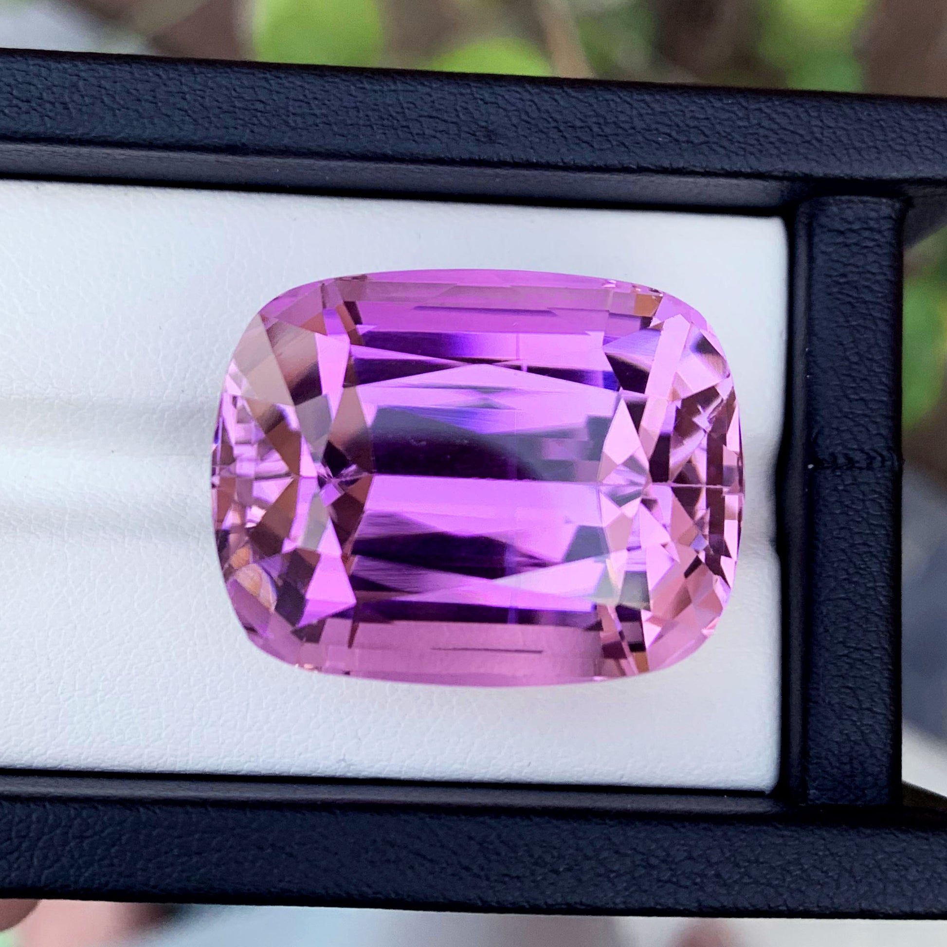 Natural untreated kunzite VVS clarity close-up
Afghan kunzite cushion cut 28x22mm profile view