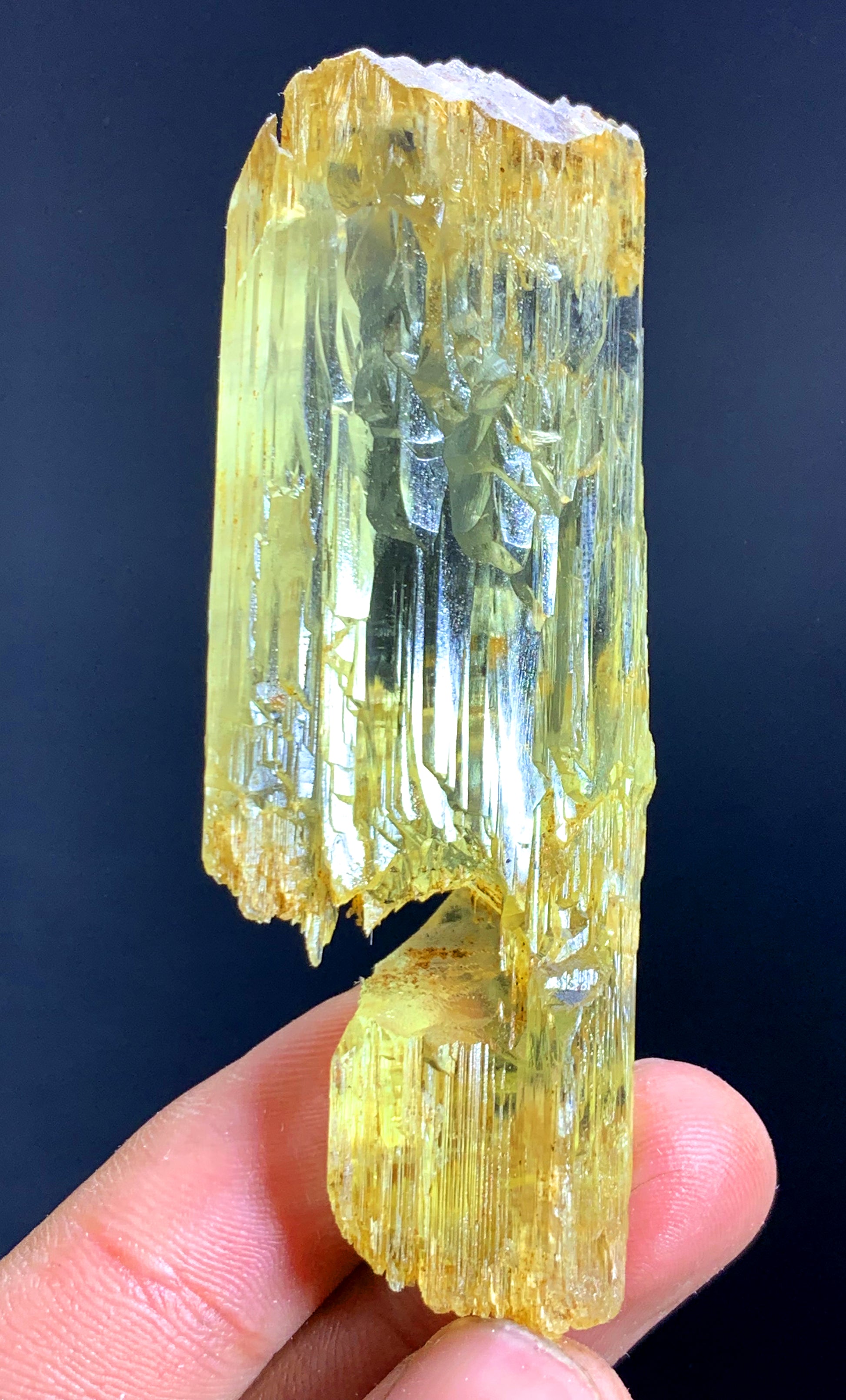 Natural yellow color detail across long triphane crystal
Long prismatic triphane crystal for display