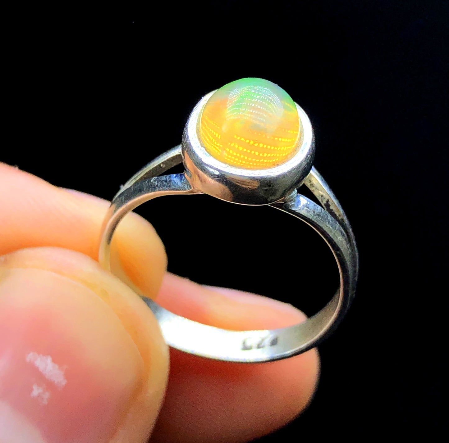 Handmade opal ring made in Ethiopia
Natural Welo opal ring 15ct close-up color detail
Ethiopian opal ring white silver band
October birthstone opal ring handmade
Natural opal ring play-of-color in light
Ethiopian Welo opal ring gift for her