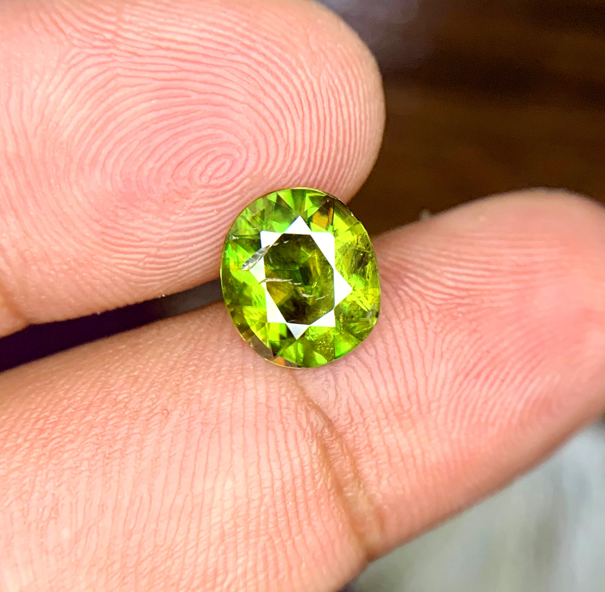 Natural untreated sphene gemstone, close-up view
Sphene gemstone, March birthstone, oval faceted cut
Full fire sphene stone, front angle view
Natural titanite sphene gemstone, side profile
Oval cut sphene gemstone, 2.00 carat, top view