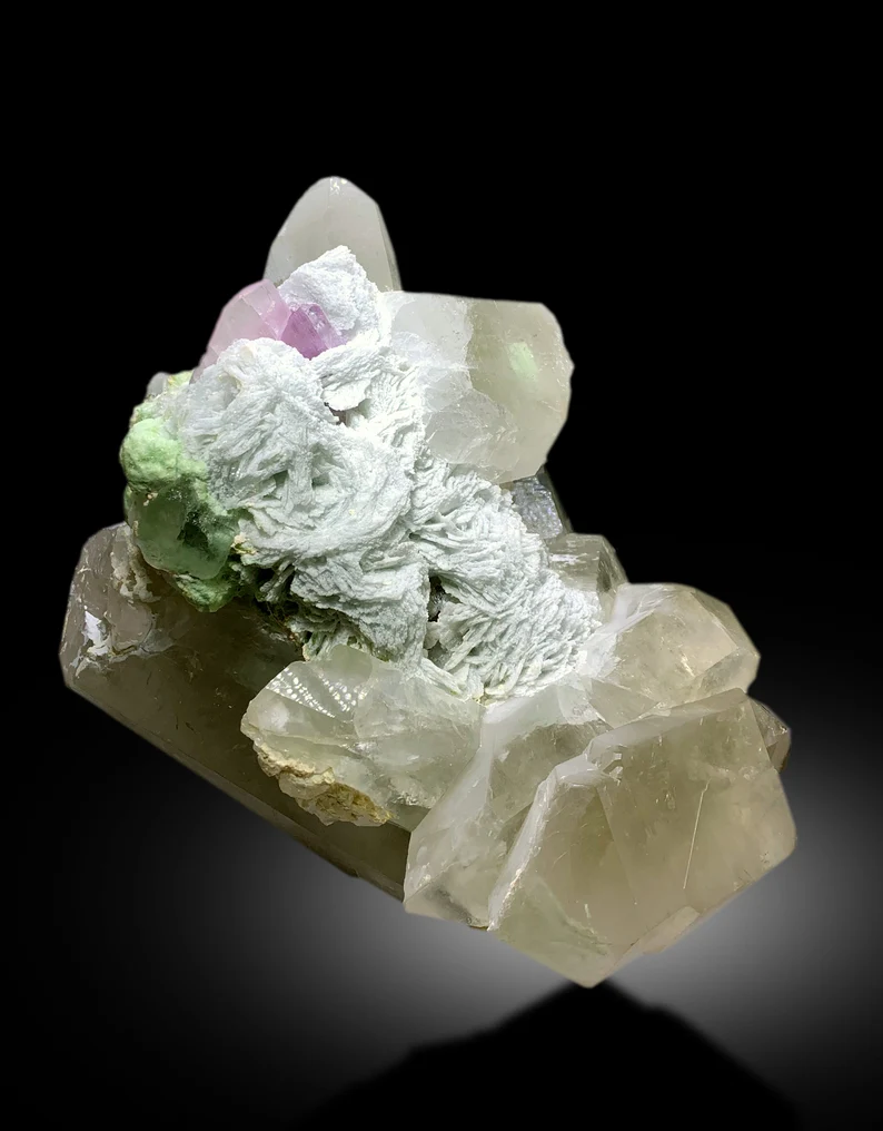 Pink kunzite color detail against green tourmaline
Self standing large mineral specimen on display