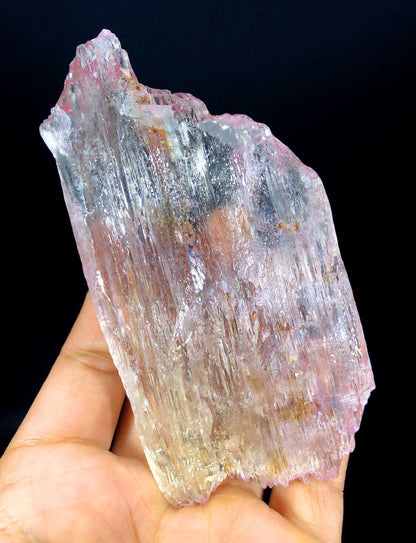 Pink kunzite crystal from Afghan pegmatite deposit
Bottom view of raw kunzite showing natural matrix base