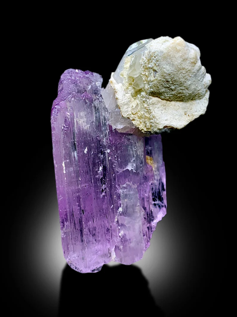 Pink kunzite good color luster close-up
Kunzite specimen size comparison 58x43x38mm
