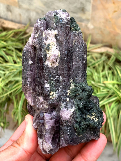 Natural scapolite with green diopside matrix
Purple scapolite mineral specimen close-up