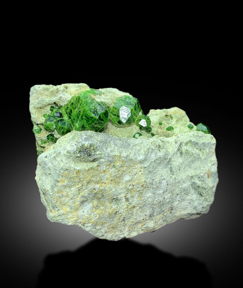 Rare lush green Demantoid Garnet crystal cluster on matrix
Natural Demantoid Garnet mineral specimen Pakistan