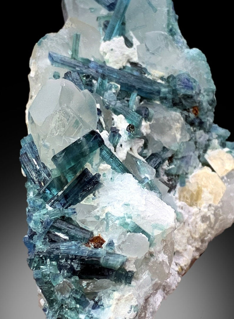 Deep blue color detail on indicolite tourmaline
Raw indicolite crystal cluster on quartz base