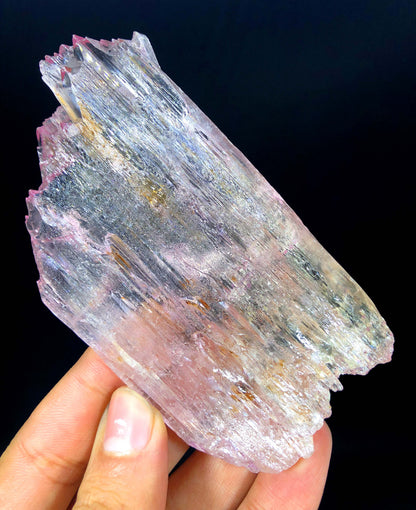 Kunzite crystal under light showing rich pink saturation
