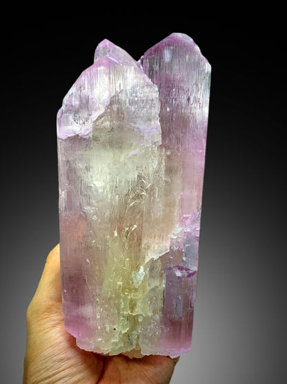 Pink kunzite crystal back angle view
Rich pink color detail on kunzite crystal
Raw mineral kunzite crystal on display stand