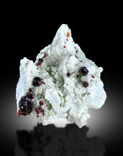 Raw red garnet mineral specimen for collectors
Garnet crystal cluster on matrix, close-up detail