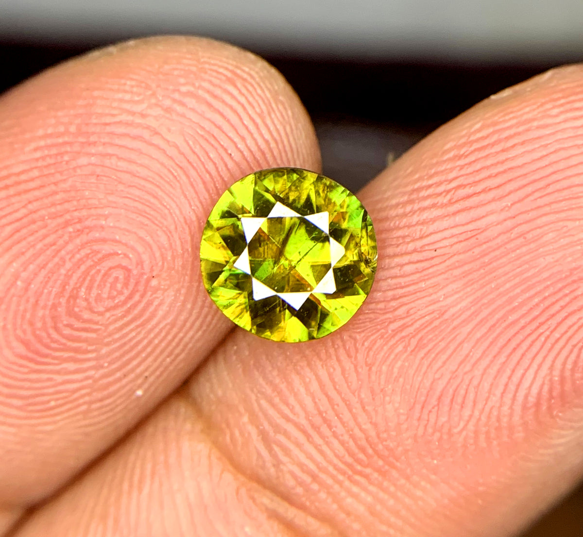 Natural untreated sphene gemstone, close-up view
Sphene gemstone, March birthstone, round faceted cut
Full fire sphene stone, front angle view
Natural titanite sphene gemstone, side profile
Round cut sphene gemstone, 1.20 carat, top view