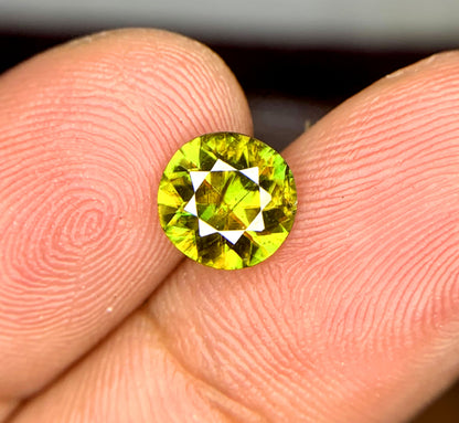 Natural untreated sphene gemstone, close-up view
Sphene gemstone, March birthstone, round faceted cut
Full fire sphene stone, front angle view
Natural titanite sphene gemstone, side profile
Round cut sphene gemstone, 1.20 carat, top view