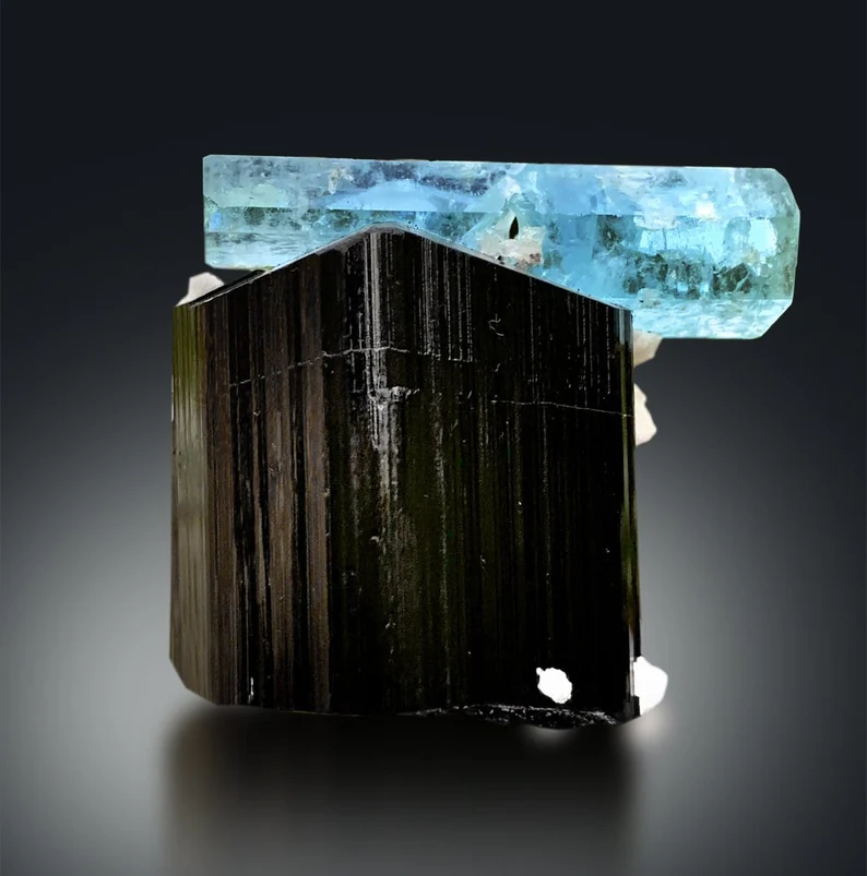 Self standing aquamarine and tourmaline specimen
Double terminated aquamarine crystal, macro detail
Schorl crystal on aquamarine specimen, side view
Aquamarine with black schorl, front angle 