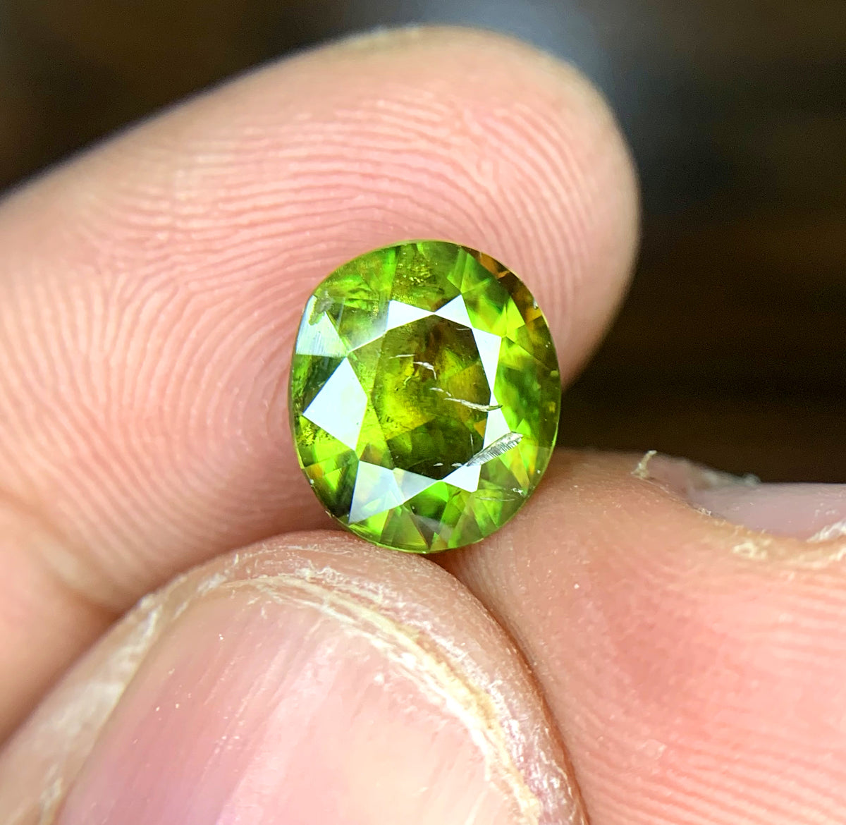 Sphene loose stone, 2.00 CT, Pakistan origin
Oval faceted sphene gemstone, natural dispersion
Sphene gemstone for jewelry, close color detail
Natural titanite sphene, oval cut, full profile
Sphene gemstone, 2.00 carat, angled display view