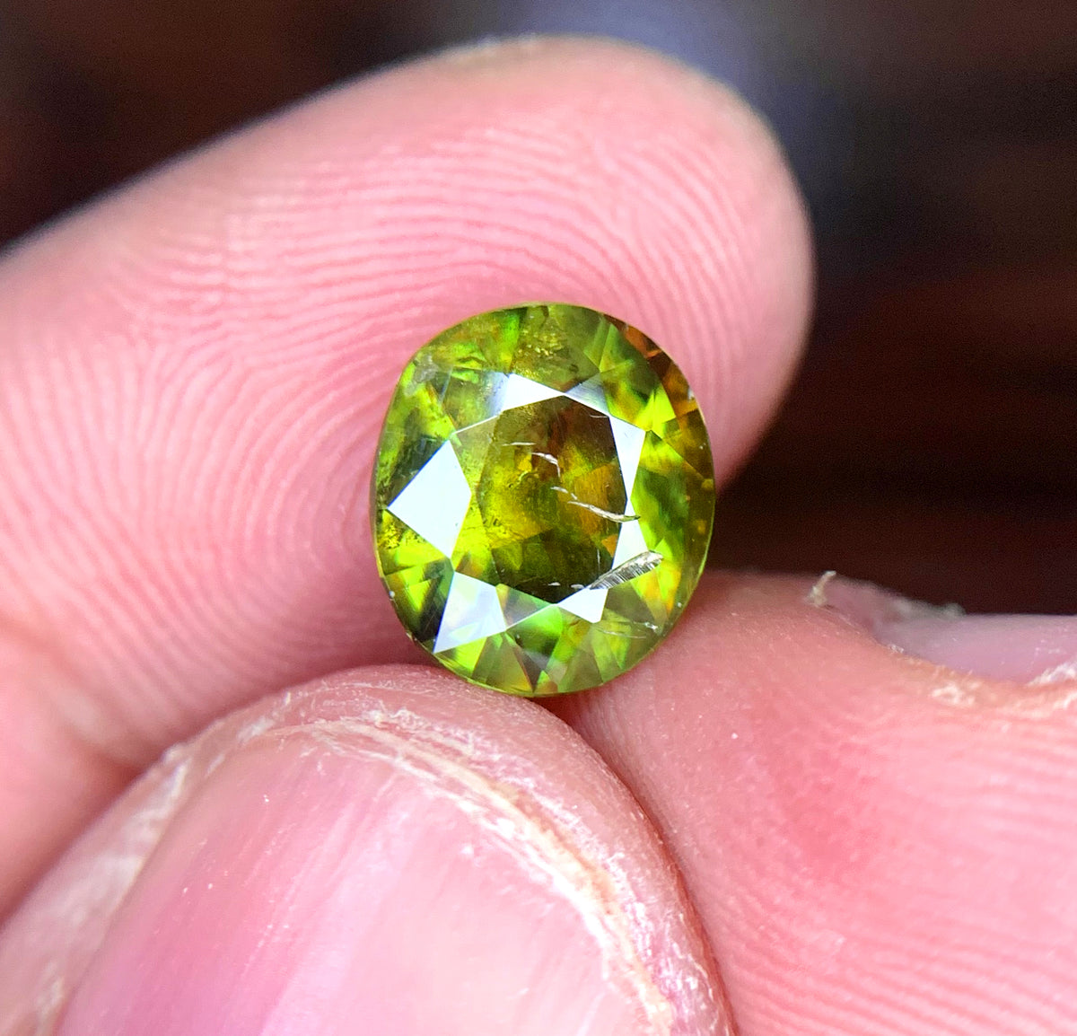 Sphene loose stone, 2.00 CT, Pakistan origin
Oval faceted sphene gemstone, natural dispersion
Sphene gemstone for jewelry, close color detail
Natural titanite sphene, oval cut, full profile
Sphene gemstone, 2.00 carat, angled display view