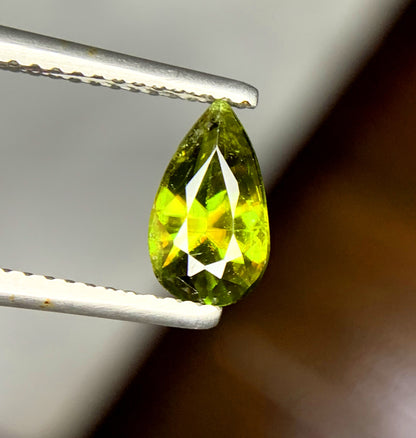 Pear sphene viewed down its length
Teardrop shaped green gemstone from the Himalayan Range