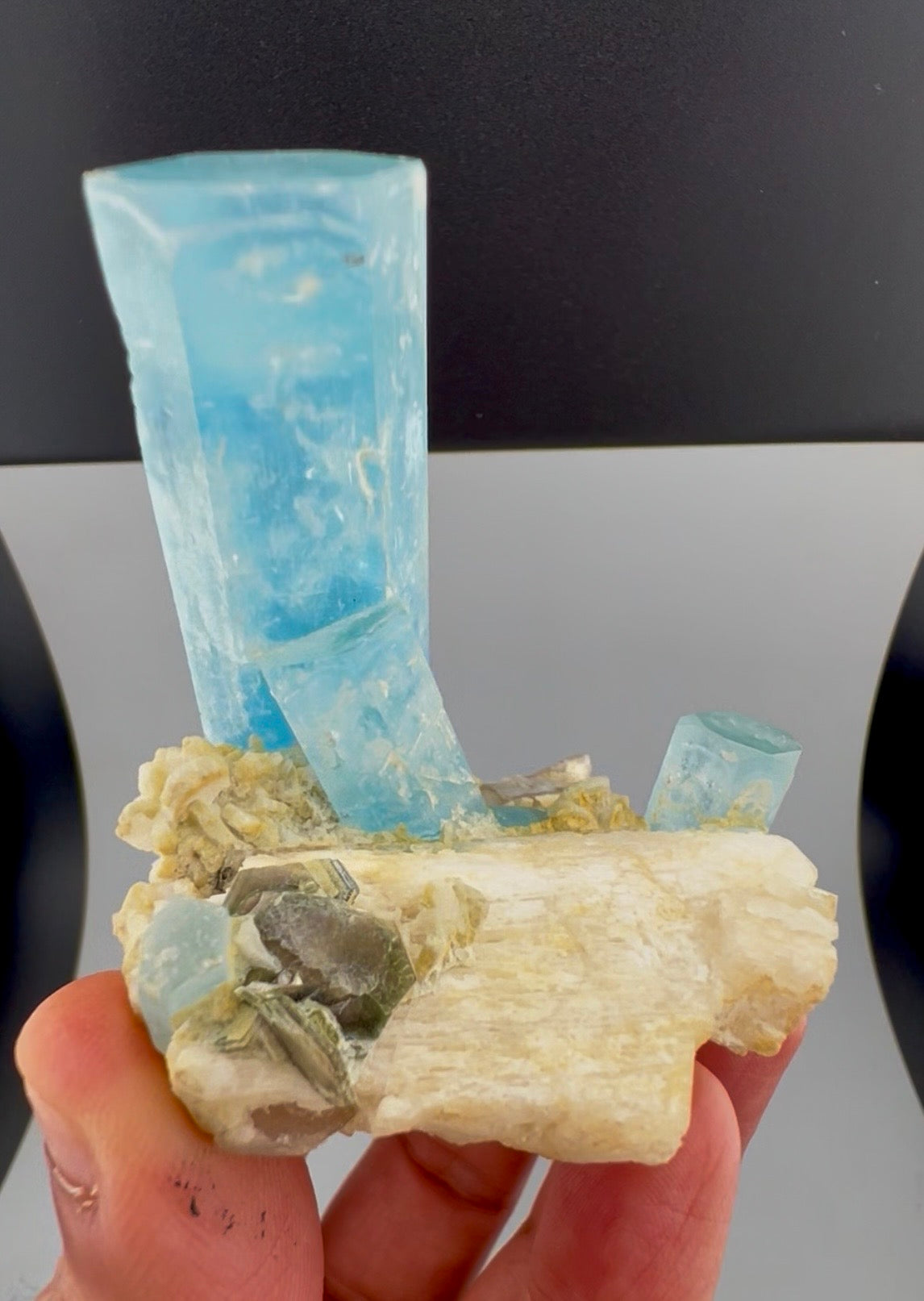 Terminated aquamarine crystals with feldspar matrix, macro shot