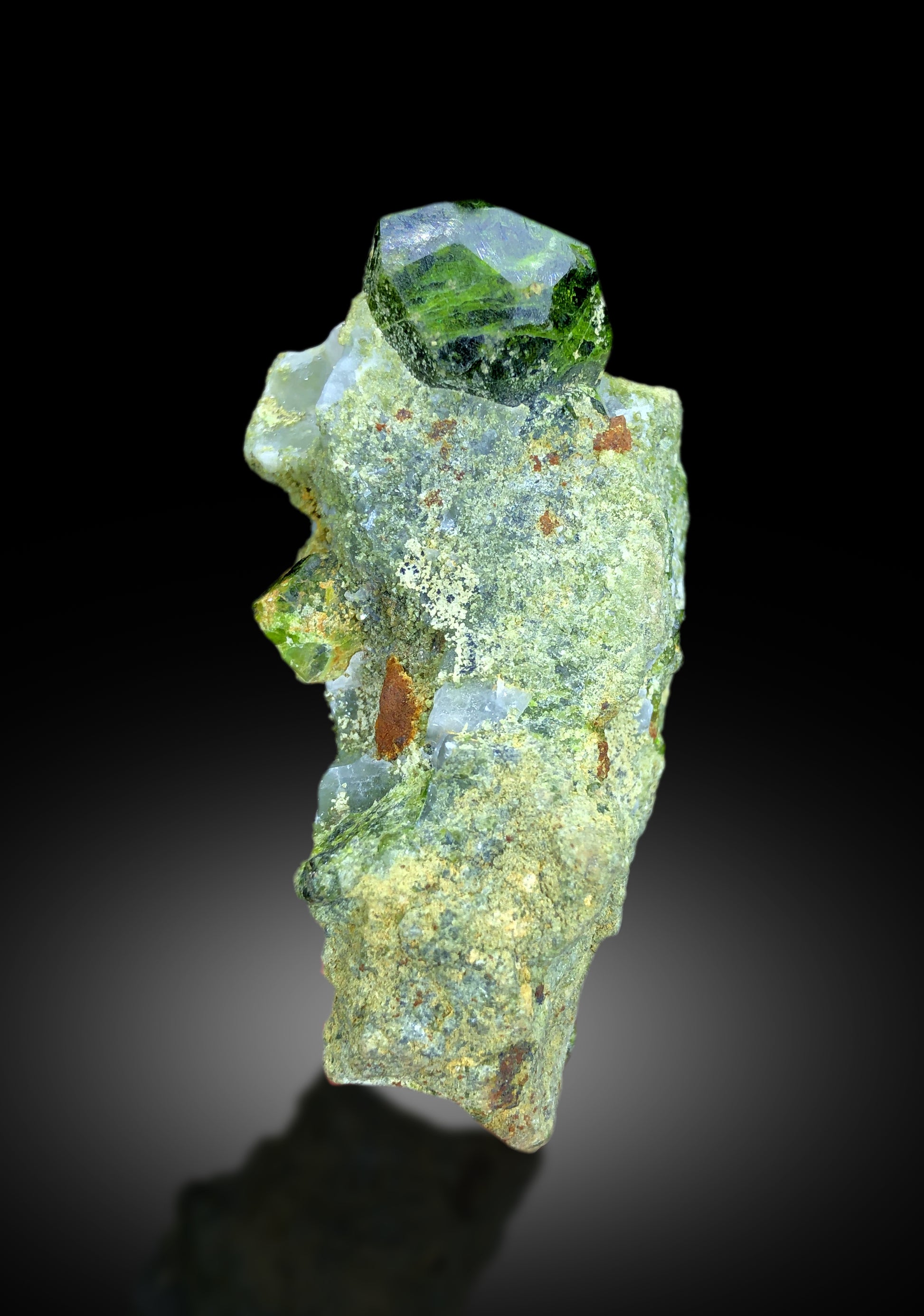 Terminated point of natural demantoid garnet crystal
Full profile of demantoid garnet on natural matrix