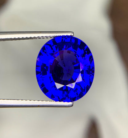 Top view of 10.61 carat tanzanite gemstone
Tanzanite gemstone with scale reference for size