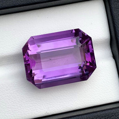 Top view of 27.45 carat amethyst gemstone
Amethyst gemstone with scale reference for size