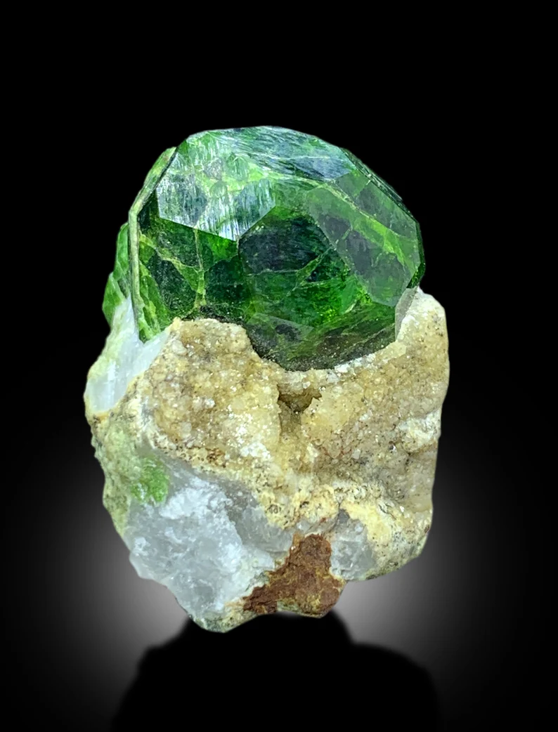 Top view of 71.55 carat garnet specimen
Demantoid garnet crystal with scale reference