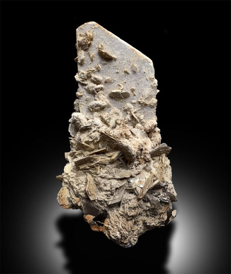 Topaz crystal cluster with microcline feldspar base
Uncleaned raw topaz specimen from Pakistan