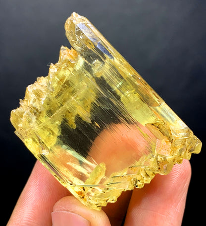 Triphane crystal dimensions 47 by 34 by 20 mm
Blocky triphane crystal back angle view
Transparent yellow color detail on blocky crystal