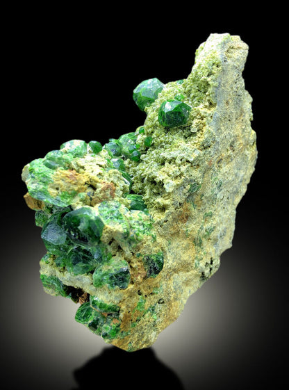 lush green demantoid garnet on matrix from Koh e Belqeys
natural green garnet mineral display piece