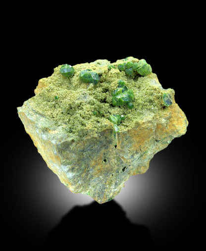 vivid demantoid garnet crystal arrangement
untreated green garnet mineral display
fine demantoid garnet specimen from Belqeys Mountain