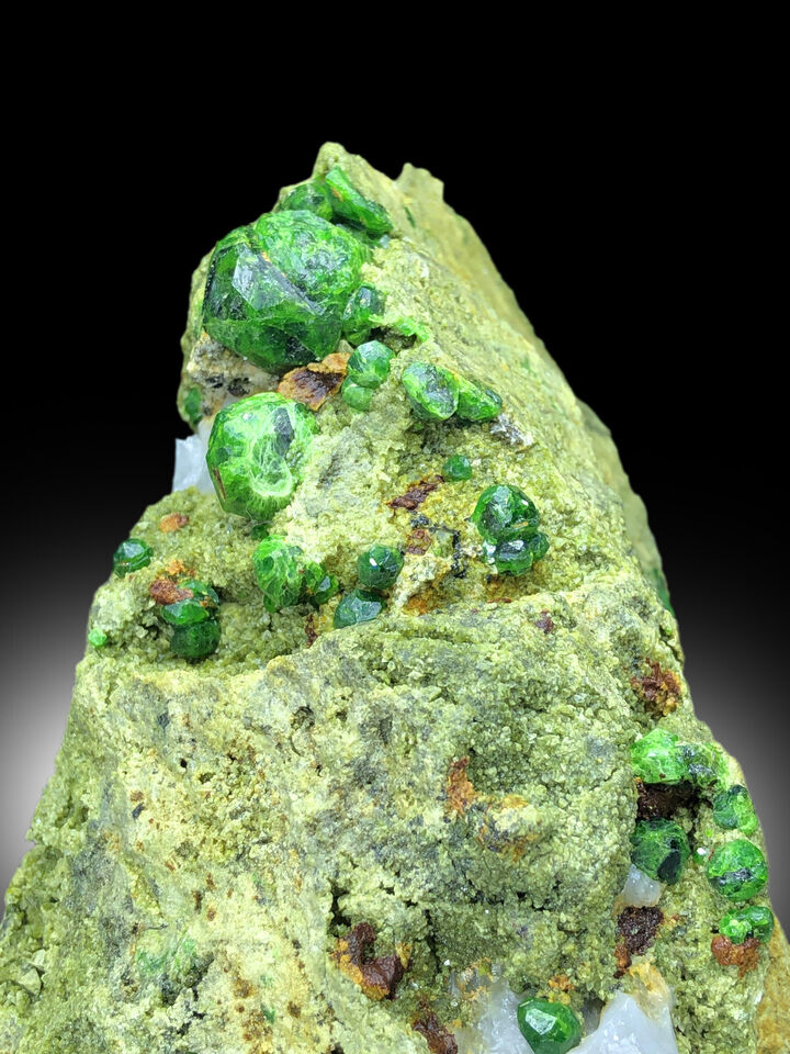 demantoid garnet on matrix natural formation
lush green garnet crystal close view
collector mineral specimen demantoid garnet
large green garnet crystal self standing

