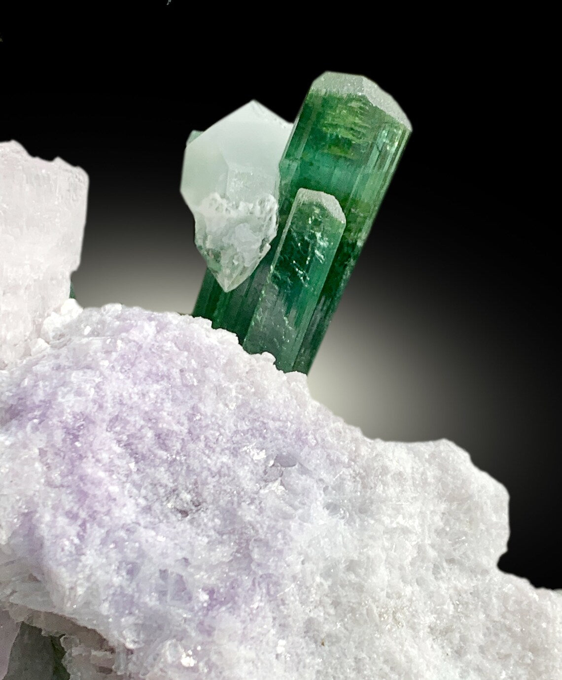 blue green tourmaline crystal with pink kunzite
lepidolite and tourmaline mineral combination