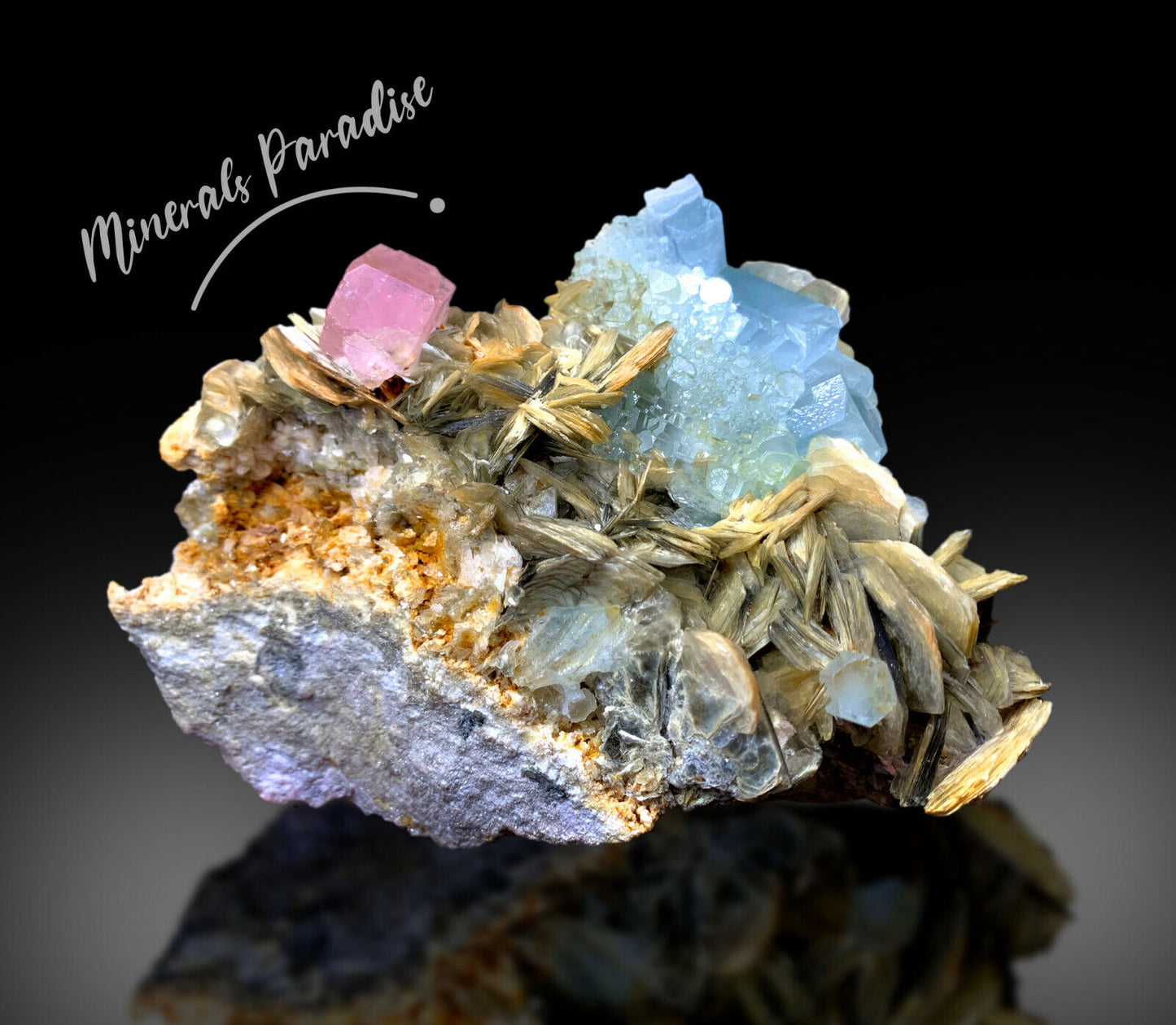 pakistan mineral specimen with pink apatite
lustrous aquamarine crystals close-up