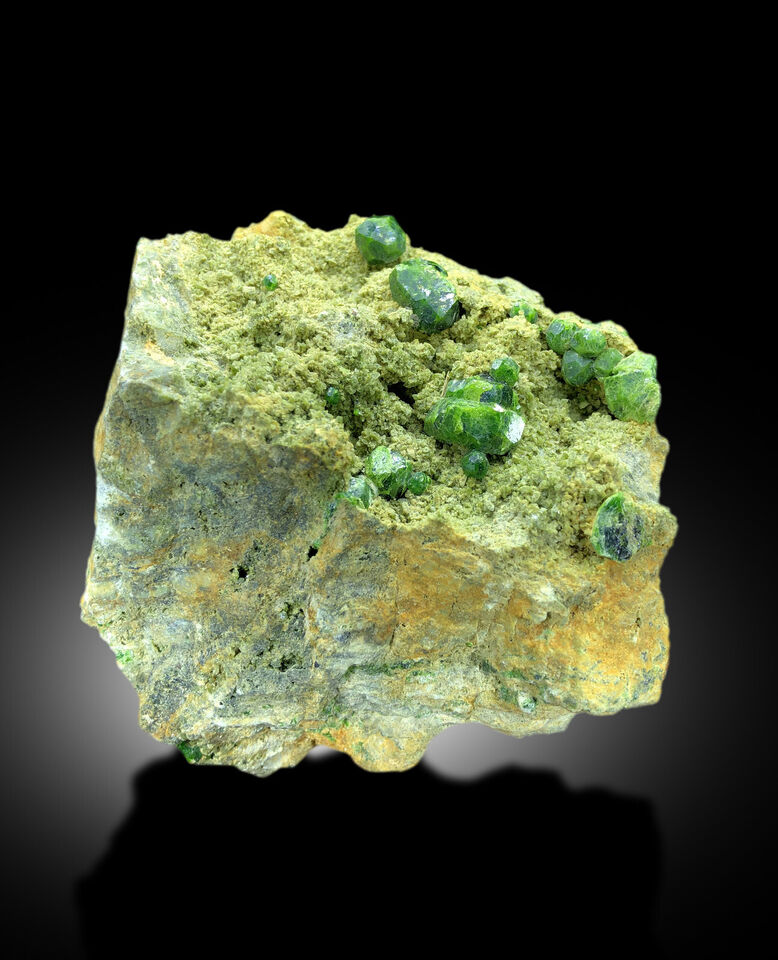 green garnet crystals with excellent luster
natural garnet formation on matrix