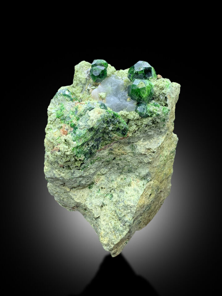 fine mineral specimen with green garnets
natural garnet on matrix collector display