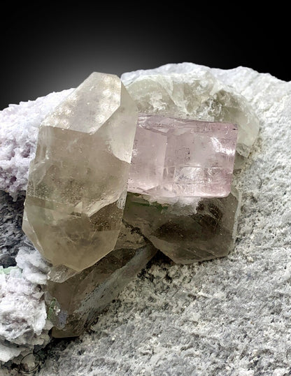 large pink morganite on feldspar matrix
green tourmaline and morganite mineral association
natural morganite quartz feldspar display specimen