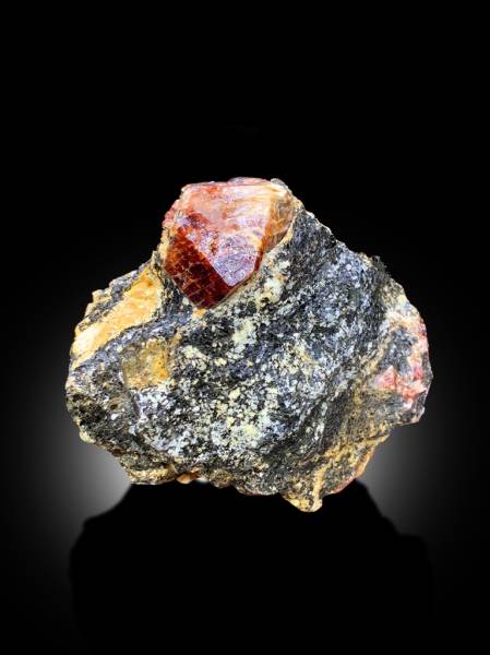 collector red zircon mineral display piece
natural zircon crystal formation close view