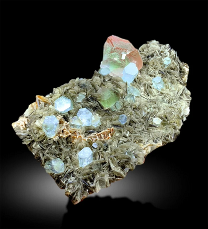 bicolor fluorite with aquamarine crystals
pink green fluorite crystal specimen