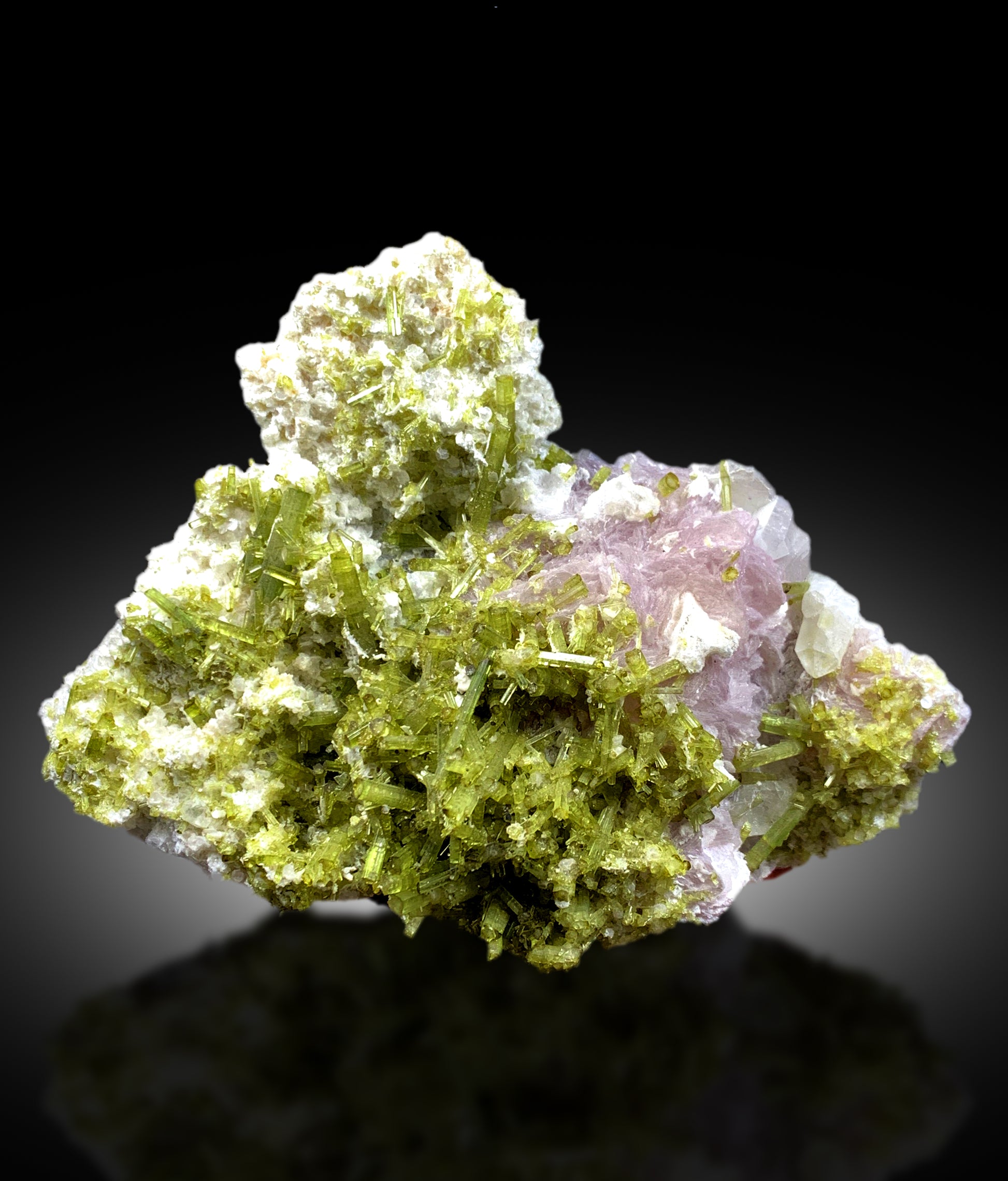 green tourmaline crystal formation
pink lepidolite and tourmaline specimen